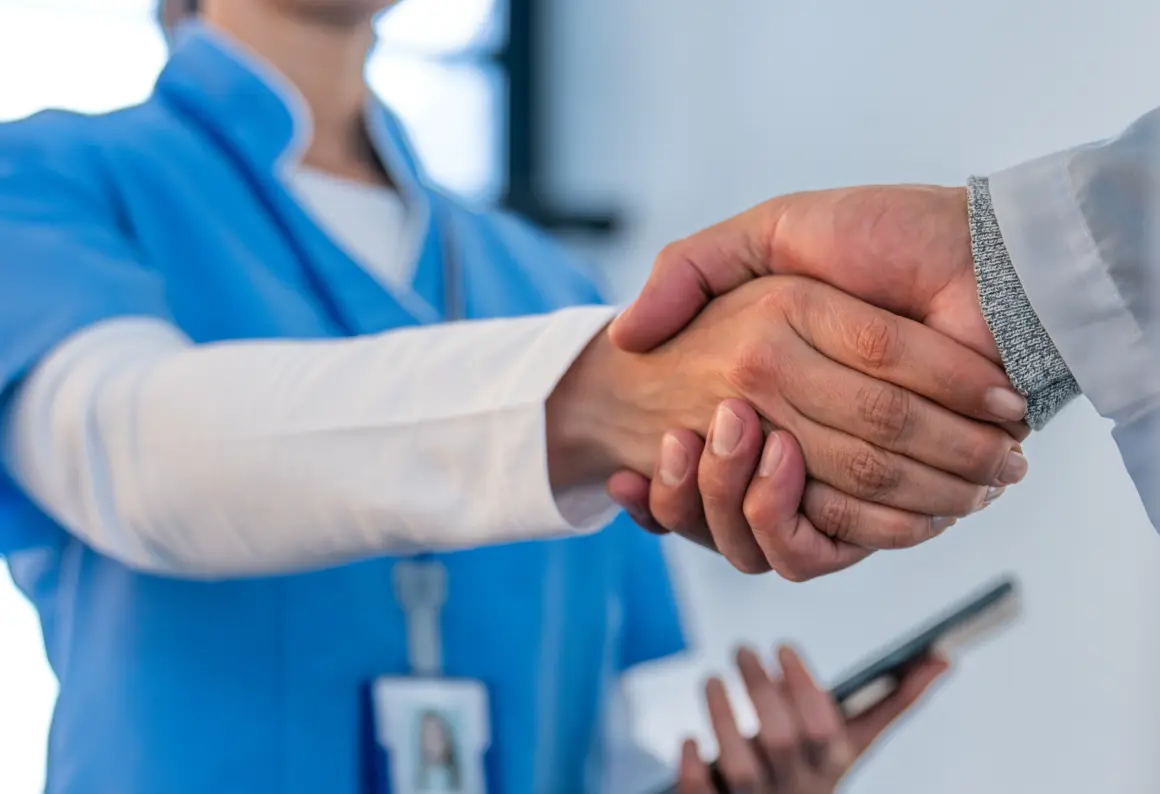 Close up of a handshake.