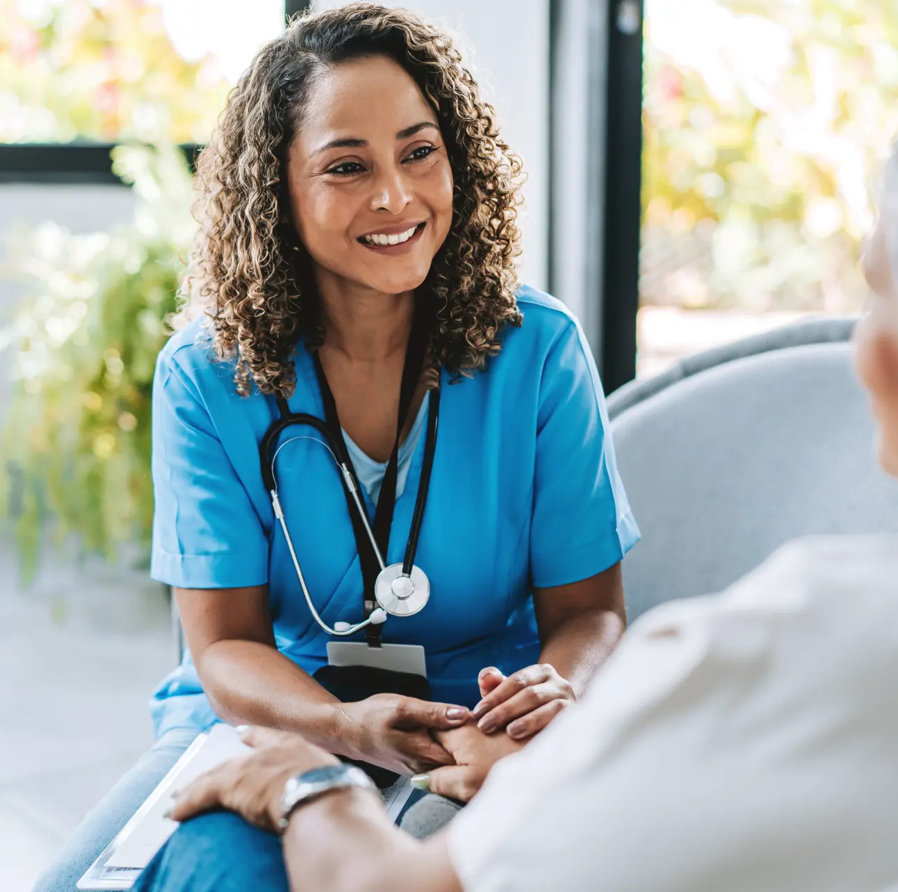 Nurse speaking with a patient.